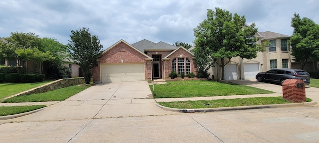 301 Crepe Myrtle Dr, Euless, TX 76039 - traditional-style house with driveway, a front yard, brick siding, and a garage