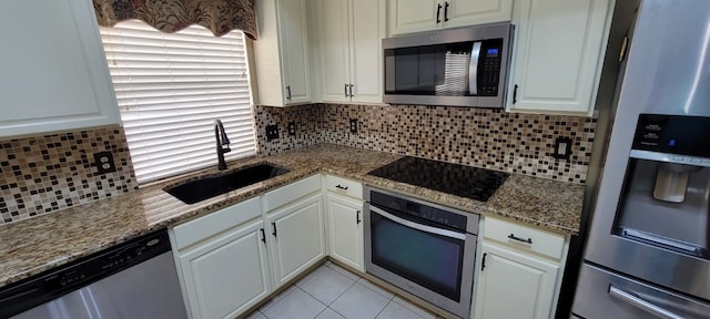 301 Crepe Myrtle Dr, Euless, TX 76039 - kitchen with stainless steel appliances, decorative backsplash, stone countertops, white cabinets, and light tile patterned floors