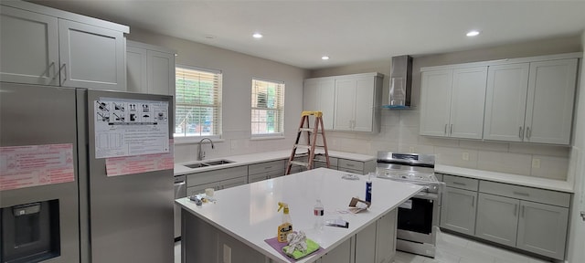 1305 Dewberry Dr, Wilmer, TX 75172 - kitchen with stainless steel appliances, wall chimney exhaust hood, a sink, a kitchen island, and backsplash