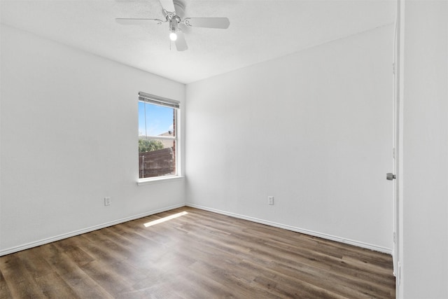 8109 Dripping Springs Dr, Fort Worth, TX 76134 - spare room featuring wood finished floors, a ceiling fan, and baseboards