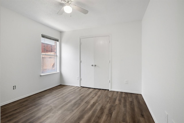 8109 Dripping Springs Dr, Fort Worth, TX 76134 - unfurnished bedroom featuring wood finished floors, baseboards, a closet, and a ceiling fan