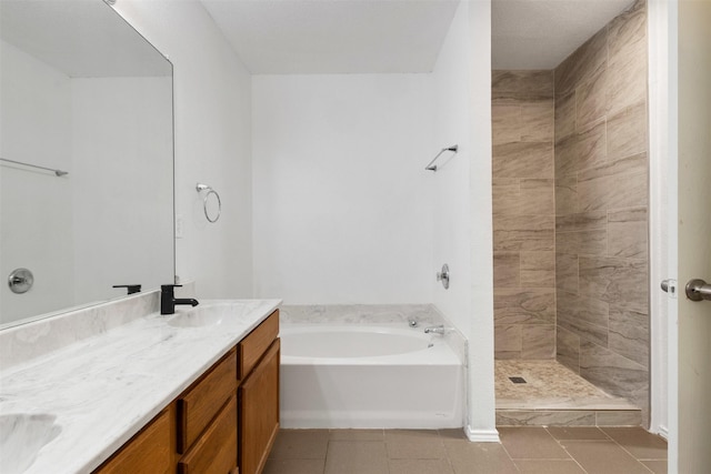 8109 Dripping Springs Dr, Fort Worth, TX 76134 - bathroom featuring a garden tub, double vanity, tile patterned floors, and a tile shower