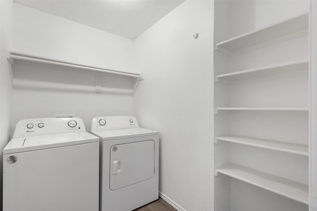8109 Dripping Springs Dr, Fort Worth, TX 76134 - laundry room with separate washer and dryer, dark wood-style floors, and baseboards