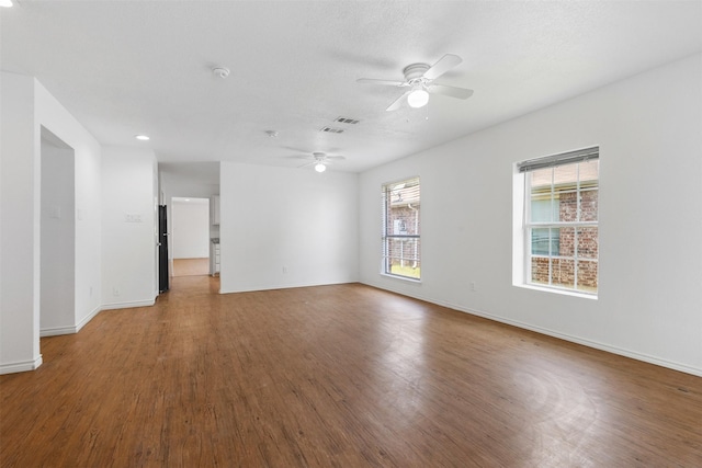 8109 Dripping Springs Dr, Fort Worth, TX 76134 - unfurnished room with a ceiling fan, wood finished floors, and baseboards