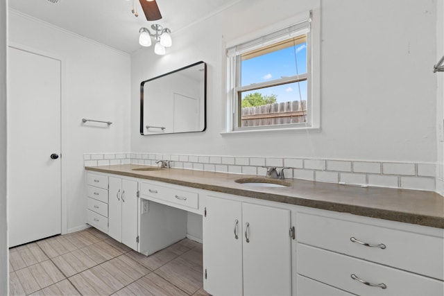 108 Mockingbird Ln, Hillsboro, TX 76645 - bathroom with double vanity, ornamental molding, tile patterned floors, and tasteful backsplash