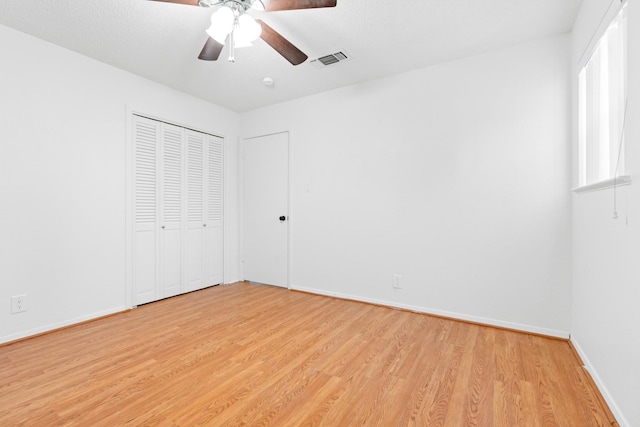 108 Mockingbird Ln, Hillsboro, TX 76645 - unfurnished bedroom featuring light wood-type flooring, baseboards, a ceiling fan, and a closet