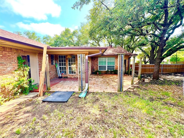 404 Westway Dr, Rockwall, TX 75087 - back of house featuring brick siding and a patio