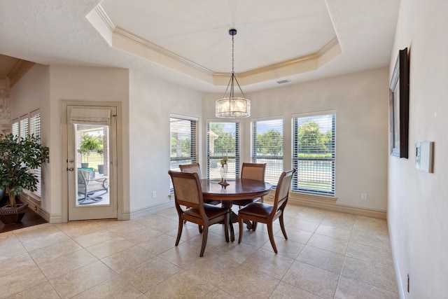 499 Savannah Hill Ln, Rockwall, TX 75032 - dining room featuring crown molding, a tray ceiling, a chandelier, baseboards, and light tile patterned floors