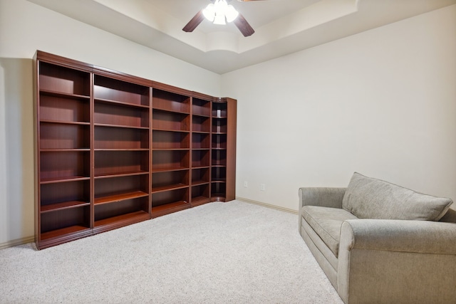 499 Savannah Hill Ln, Rockwall, TX 75032 - living area featuring carpet, a tray ceiling, ceiling fan, and baseboards