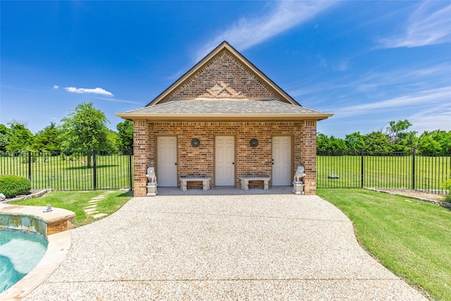 499 Savannah Hill Ln, Rockwall, TX 75032 - view of front of home with brick siding, roof with shingles, and a patio area