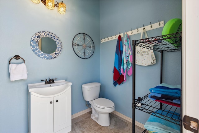 499 Savannah Hill Ln, Rockwall, TX 75032 - bathroom featuring vanity, toilet, baseboards, and tile patterned flooring