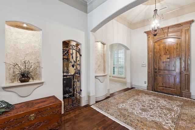 499 Savannah Hill Ln, Rockwall, TX 75032 - foyer featuring dark wood-style flooring, arched walkways, and ornamental molding