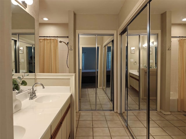 5309 San Mateo Ct, Arlington, TX 76017 - full bath with double vanity, tile patterned flooring, a shower with shower curtain, and recessed lighting