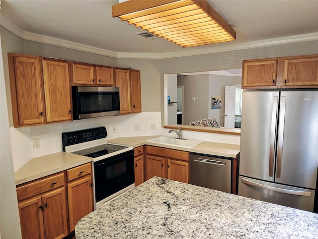 5309 San Mateo Ct, Arlington, TX 76017 - kitchen featuring stainless steel appliances, a sink, ornamental molding, decorative backsplash, and brown cabinetry