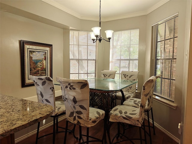 5309 San Mateo Ct, Arlington, TX 76017 - dining area featuring baseboards, wood finished floors, a chandelier, and ornamental molding