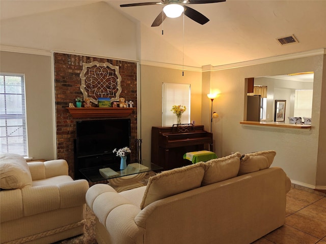 5309 San Mateo Ct, Arlington, TX 76017 - living room featuring ceiling fan, tile patterned flooring, vaulted ceiling, crown molding, and baseboards