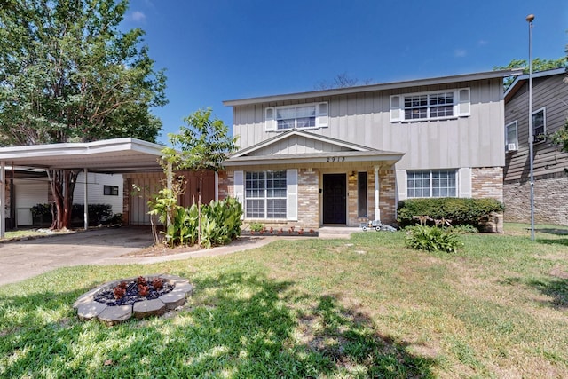 2913 Harlan Dr, Mesquite, TX 75150 - traditional-style home with a carport, a front yard, an outdoor fire pit, driveway, and board and batten siding