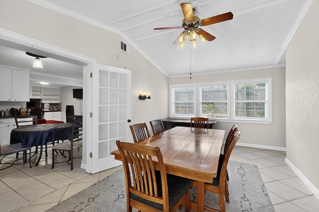 2913 Harlan Dr, Mesquite, TX 75150 - dining space with light tile patterned flooring, lofted ceiling, ceiling fan, baseboards, and ornamental molding