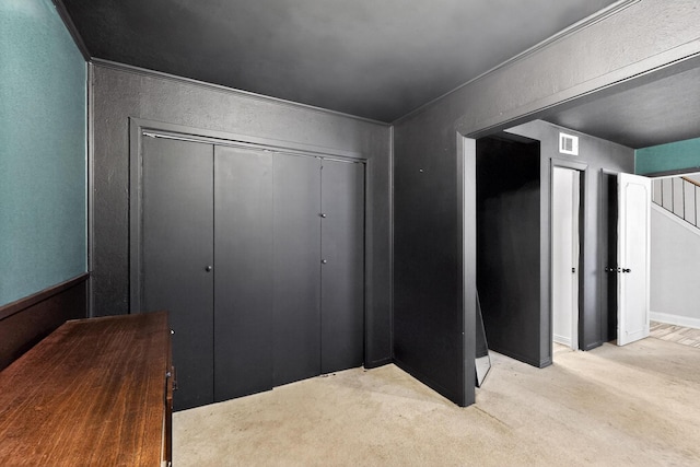 2913 Harlan Dr, Mesquite, TX 75150 - unfurnished bedroom featuring light colored carpet, a closet, a textured wall, and baseboards
