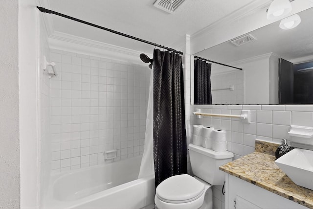 2913 Harlan Dr, Mesquite, TX 75150 - full bathroom with crown molding, tile walls, vanity, shower / tub combo, and toilet