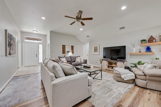 1301 Shell Beach Dr, Little Elm, TX 75068 - living area featuring vaulted ceiling, ceiling fan, light wood-style floors, baseboards, and recessed lighting