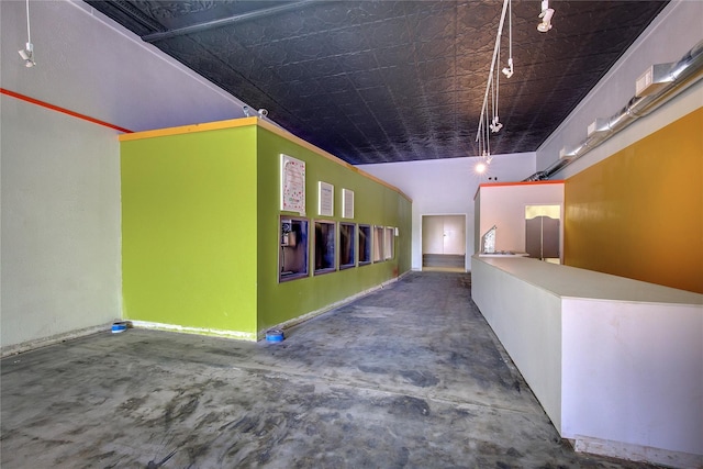 1213 Washington St Unit B, Commerce, TX 75428 - hall with concrete floors and an ornate ceiling