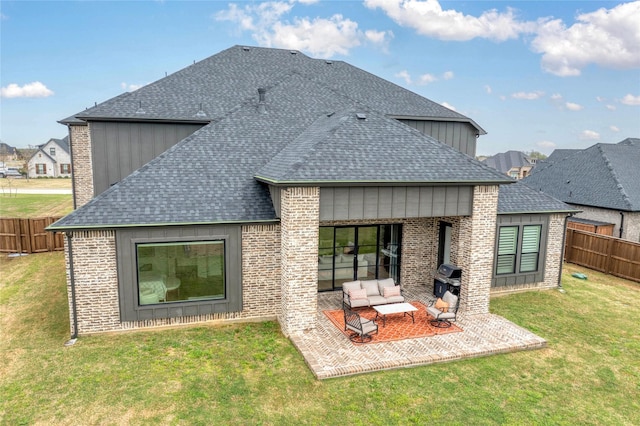 105 Shawnee Trl, Pottsboro, TX 75076 - back of house with a shingled roof, brick siding, and board and batten siding