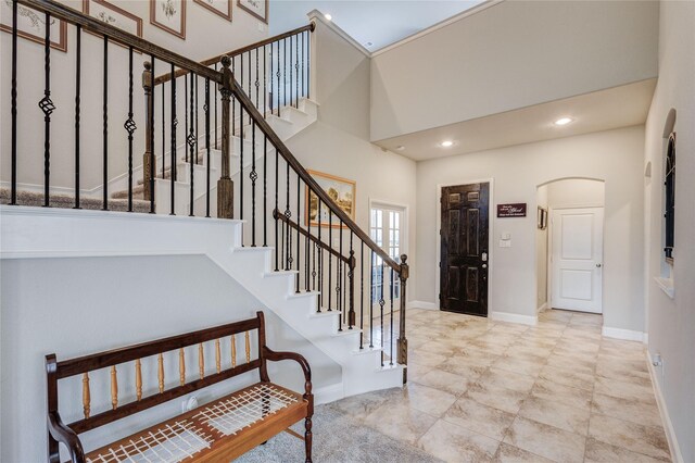 1211 Great Meadows Dr, Wylie, TX 75098 - kitchen with stainless steel appliances, arched walkways, a sink, a ceiling fan, and an island with sink