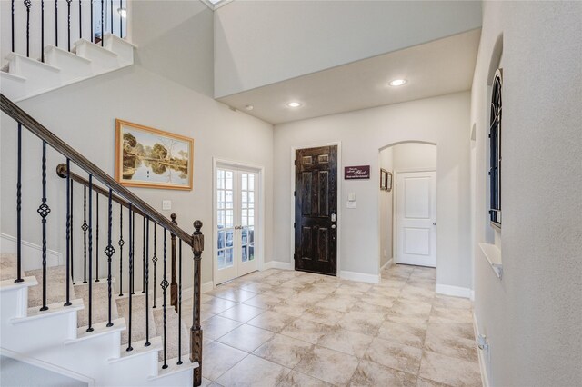 1211 Great Meadows Dr, Wylie, TX 75098 - foyer entrance featuring arched walkways, stairs, french doors, and recessed lighting