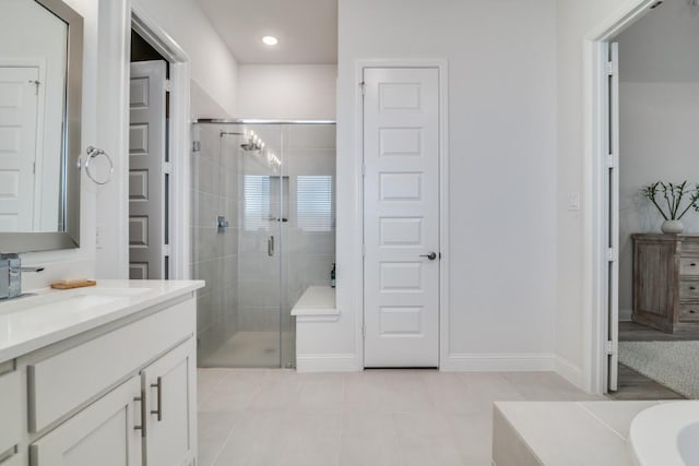 1721 Gem Dr, Rockwall, TX 75087 - bathroom featuring vanity, a stall shower, tile patterned floors, baseboards, and recessed lighting