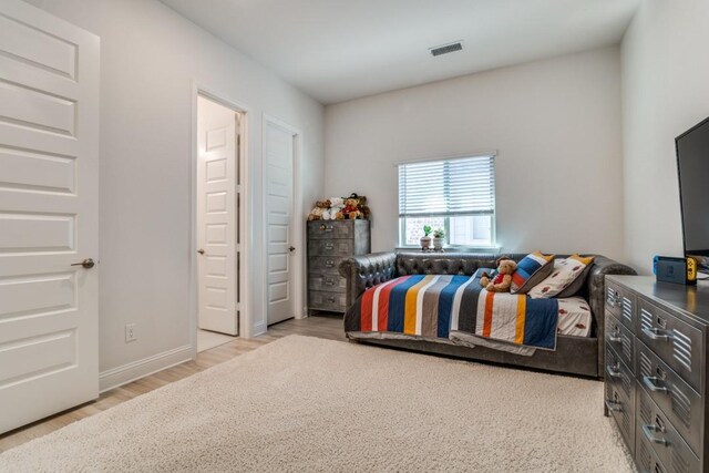 1721 Gem Dr, Rockwall, TX 75087 - bedroom with wood finished floors and baseboards