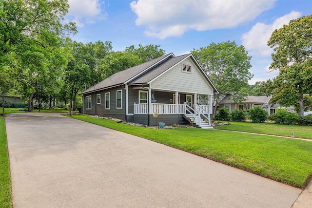 2832 Forest Ave, Fort Worth, TX 76112 - view of front of house with a porch, concrete driveway, and a front lawn