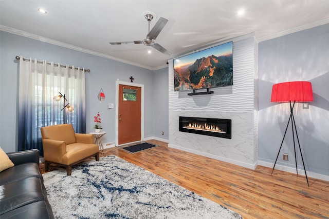 2832 Forest Ave, Fort Worth, TX 76112 - living room featuring crown molding, wood finished floors, baseboards, a fireplace, and ceiling fan