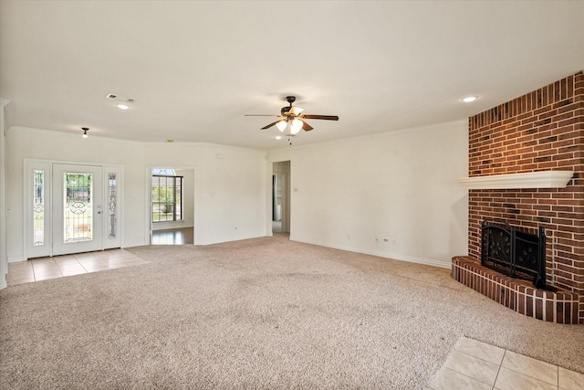 104 Spring Creek Dr, Waxahachie, TX 75165 - unfurnished living room with carpet, tile patterned floors, ceiling fan, a fireplace, and crown molding