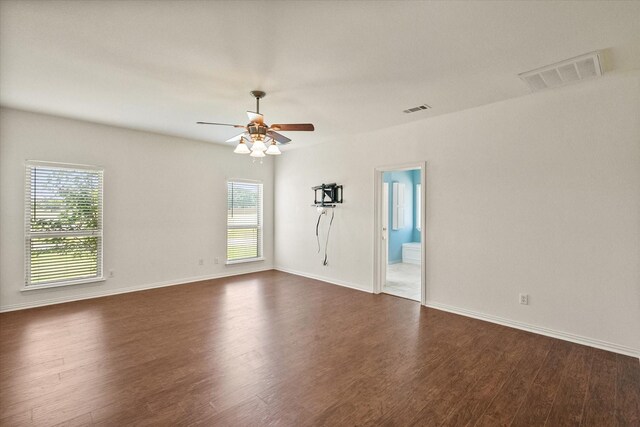 104 Spring Creek Dr, Waxahachie, TX 75165 - unfurnished room with dark wood-style flooring, ceiling fan, plenty of natural light, and baseboards