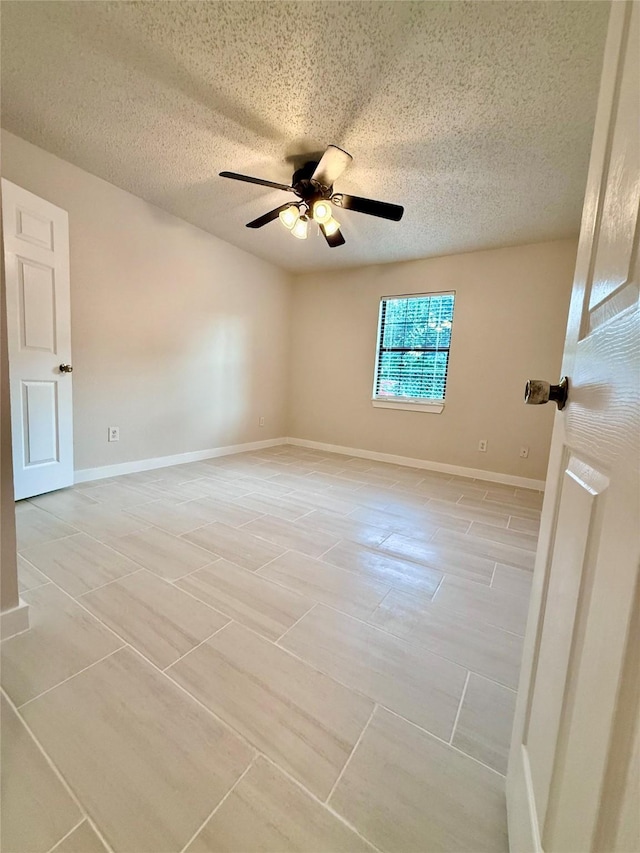 739 W Pine St, Jacksboro, TX 76458 - unfurnished room with ceiling fan, a textured ceiling, and baseboards