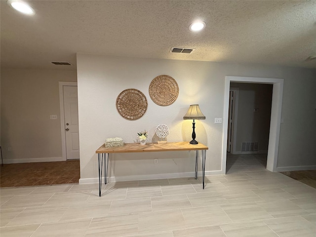 739 W Pine St, Jacksboro, TX 76458 - hall with a textured ceiling, recessed lighting, and baseboards