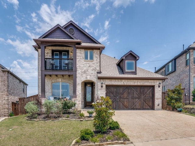 1517 Port Millstone Trl, Wylie, TX 75098 - view of front facade featuring a balcony, brick siding, an attached garage, and concrete driveway