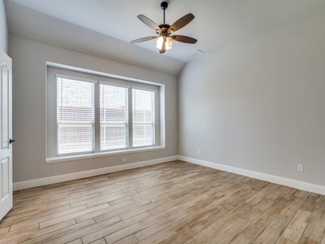1517 Port Millstone Trl, Wylie, TX 75098 - spare room with light wood-style floors, baseboards, ceiling fan, and vaulted ceiling