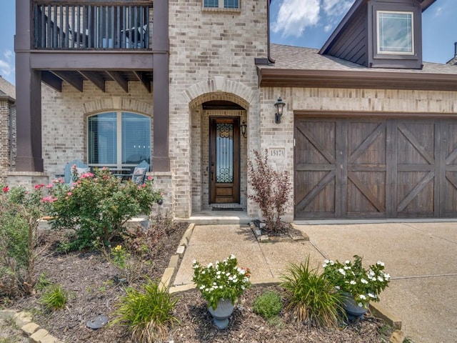 1517 Port Millstone Trl, Wylie, TX 75098 - view of exterior entry featuring a balcony, brick siding, a garage, and a shingled roof