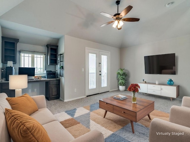 1517 Port Millstone Trl, Wylie, TX 75098 - living area with light carpet, lofted ceiling, ceiling fan, french doors, and baseboards