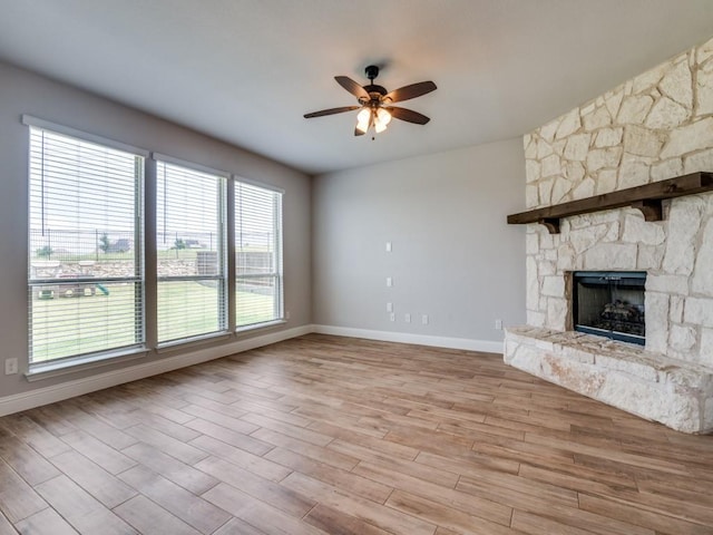 1517 Port Millstone Trl, Wylie, TX 75098 - unfurnished living room featuring a ceiling fan, healthy amount of natural light, and baseboards