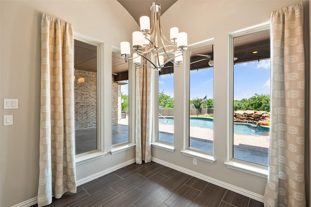 704 Prairie Timber Rd, Burleson, TX 76028 - unfurnished dining area with baseboards, a chandelier, and wood tiled floors