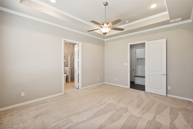 704 Prairie Timber Rd, Burleson, TX 76028 - unfurnished bedroom featuring a tray ceiling, crown molding, carpet flooring, ensuite bathroom, and recessed lighting
