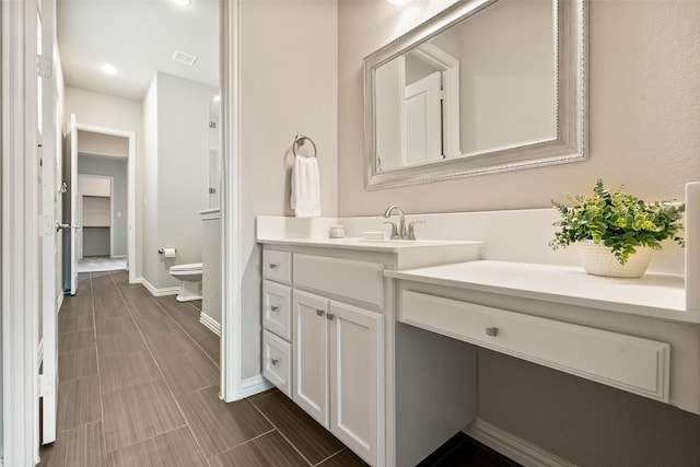 704 Prairie Timber Rd, Burleson, TX 76028 - bathroom featuring vanity, baseboards, and toilet