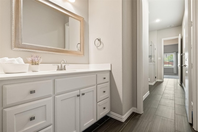 704 Prairie Timber Rd, Burleson, TX 76028 - bathroom featuring baseboards and vanity