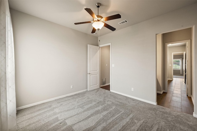 704 Prairie Timber Rd, Burleson, TX 76028 - unfurnished bedroom featuring carpet, baseboards, and a ceiling fan