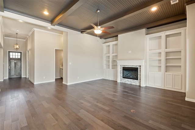 704 Prairie Timber Rd, Burleson, TX 76028 - unfurnished living room featuring baseboards, beam ceiling, dark wood finished floors, a ceiling fan, and a fireplace