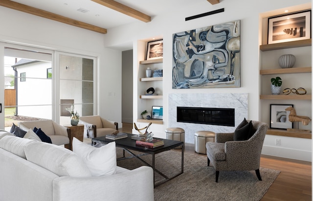 4207 Valley Ridge Rd, Dallas, TX 75220 - living room with built in features, wood finished floors, beamed ceiling, a fireplace, and baseboards