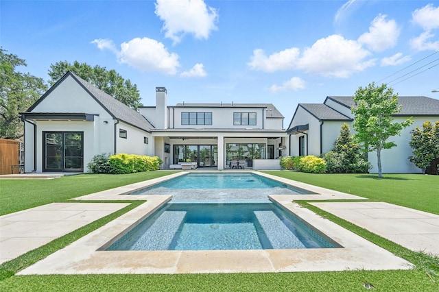 4207 Valley Ridge Rd, Dallas, TX 75220 - rear view of house with a yard, stucco siding, and an outdoor pool